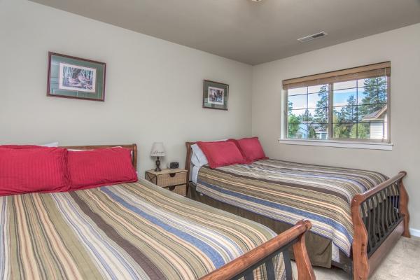 South wing bedroom boasts 2 queen size beds with private full bathroom.