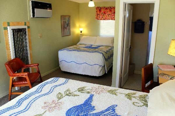 Some rooms at the Blue Swallow have two comfortable beds.