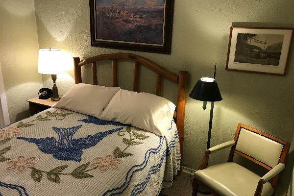 Each room features unique, authentic period decor, including chenille bedspreads, vintage lighting, and rotary-dial phones from 1939.