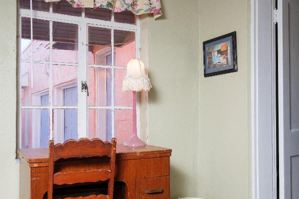 Desk in the parlor is a great place to write postcards to family and friends.