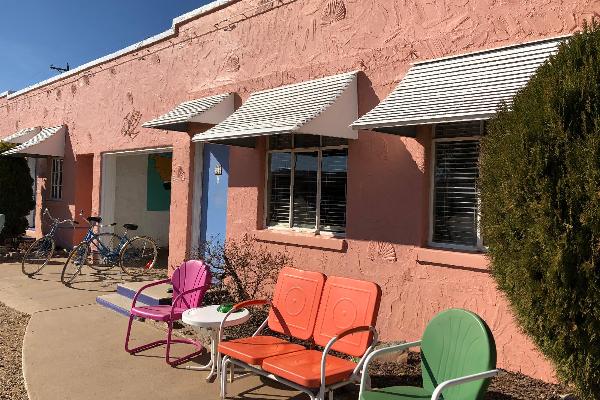 Outside every room is a patio with period-style metal furniture to enjoy the afternoon or evening in.