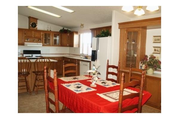 kitchen table expands to hold approx. 10-11 extra stools at bar