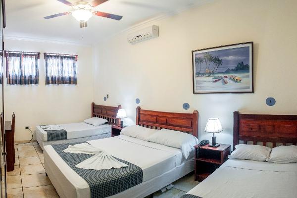 This is a triple room with 2 queen beds and 1 small bed
