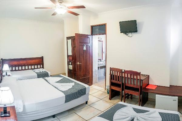 This is a triple room with 2 queen beds and 1 small bed