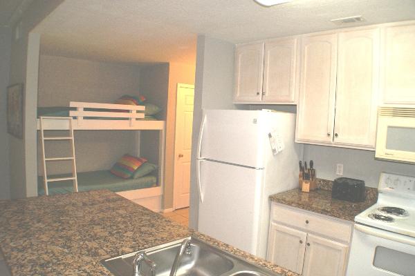 Bunk beds next to kitchen