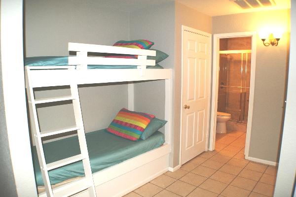 Bunk beds next to kitchen