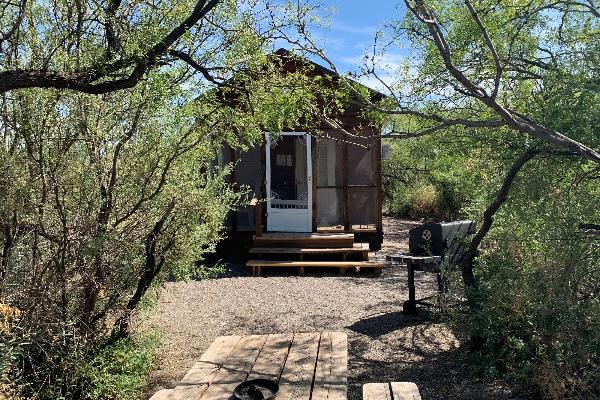 Each standard cabin has private picnic area with charcoal grill and table