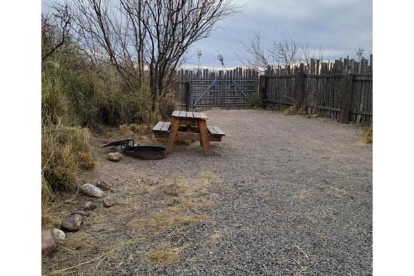 Tent Site L (Clothing Optional Fence Board)