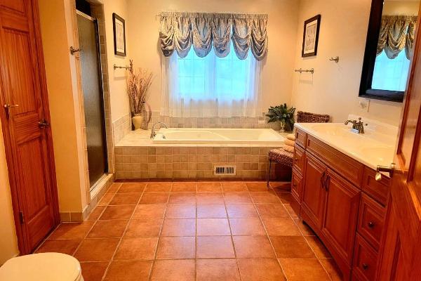 Luxurious bathroom with walk-in shower and large soaker tub