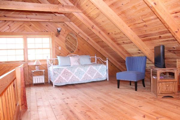 Loft area with daybed and TV