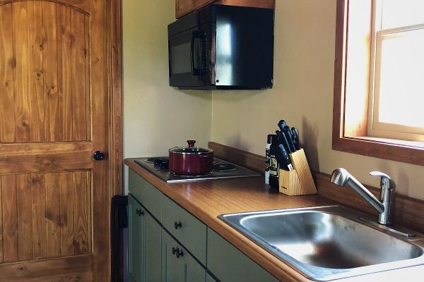 Basic utensils, flatware and dishes are included in the kitchen.
