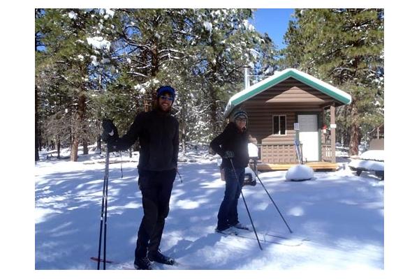 Crosscountry skiers enjoying the trails outside their cabin