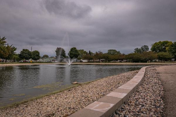 Pond and fountain by pavilion