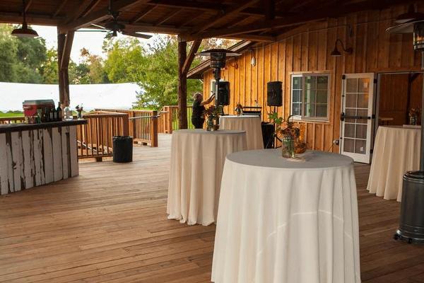 The covered deck is great for cocktail hour, fresh air, and staying sheltered from the weather. Ceiling fans and space heaters help keep it comfortable.