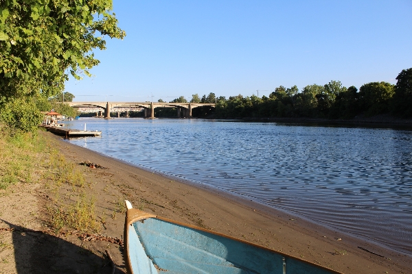 The American River from the shores of Camp Pollock. Looking up river at 160 and the Sacramento Northern Bikeway River bridge to C street. 