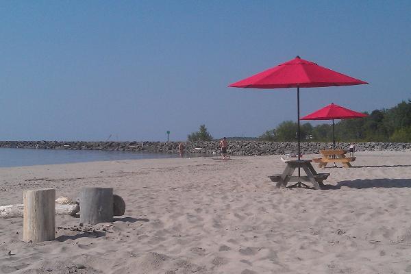 Private Beach with tables and umbrellas for our guests