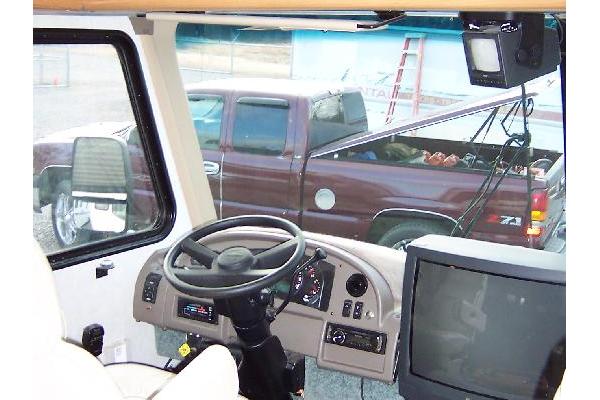 Driver area with leather captain seats, cb radio, back-up camera, etc.