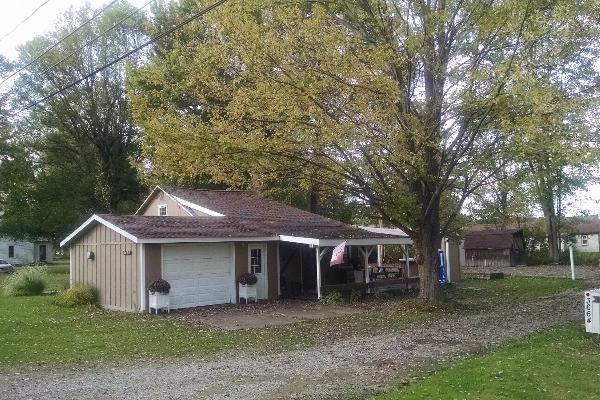 Enjoy the porch to sip wine and toast the tranquility. The private side yard is your outdoor entertainment area and dining room with 2 tables, a tiki bar, horseshoe pits, a Weber charcoal BBQ, a gas g